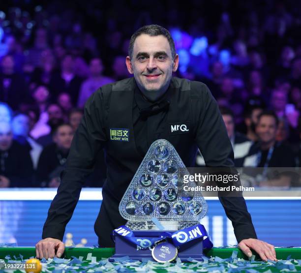 Ronnie O’Sullivan of England poses for a photo with the Paul Hunter Trophy after victory in the Final match between Ronnie O’Sullivan of England and...