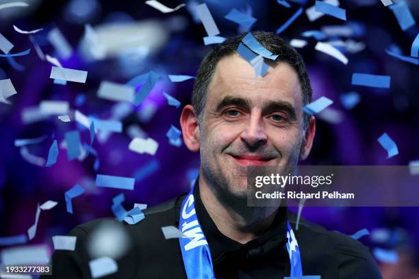 Ronnie O’Sullivan of England reacts surrounded by confetti after victory in the Final match between Ronnie O’Sullivan of England and Ali Carter of...