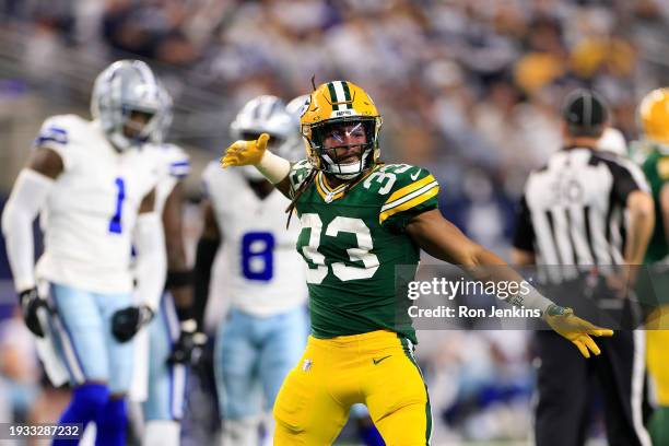 Aaron Jones of the Green Bay Packers reacts to a first down against the Dallas Cowboys in the first quarter of the NFC Wild Card Playoff game at AT&T...