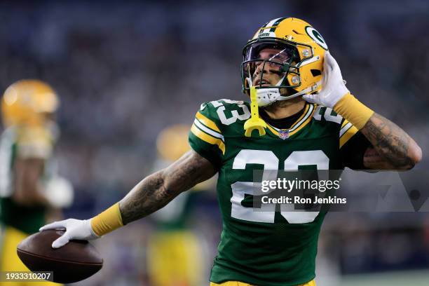 Jaire Alexander of the Green Bay Packers reacts to an interception during the first quarter against the Dallas Cowboys in the NFC Wild Card Playoff...