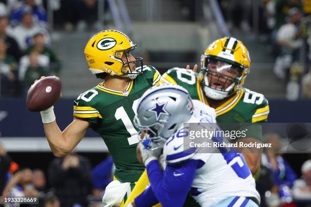 Jordan Love of the Green Bay Packers looks to pass during the second quarter against the Dallas Cowboys in the NFC Wild Card Playoff game at AT&T...