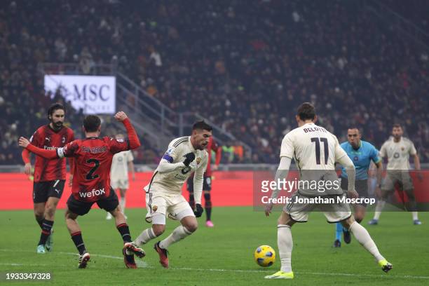 Davide Calabria of AC Milan upends Lorenzo Pellegrini of AS Roma in the area to conceed a penalty during the Serie A TIM match between AC Milan and...