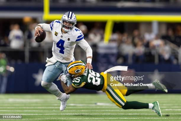 Dak Prescott of the Dallas Cowboys reacts as he's sacked by Keisean Nixon of the Green Bay Packers during an NFL wild-card playoff football game...