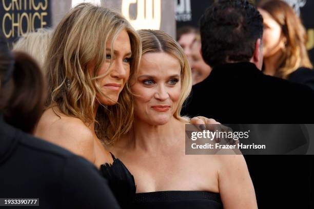 Jennifer Aniston and Reese Witherspoon attend the 29th Annual Critics Choice Awards at Barker Hangar on January 14, 2024 in Santa Monica, California.