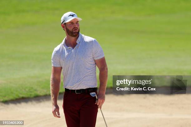 Grayson Murray of the United States follows a shot from a bunker on the tenth hole during the final round of the Sony Open in Hawaii at Waialae...