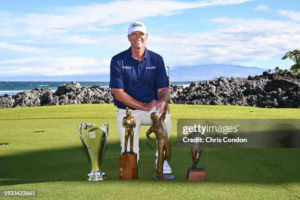 Steve Stricker poses with the Schwab Cup Trophy, the Arnold Palmer Award, the Jack Nicklaus Award and the Byron Nelson Award prior to the PGA TOUR...