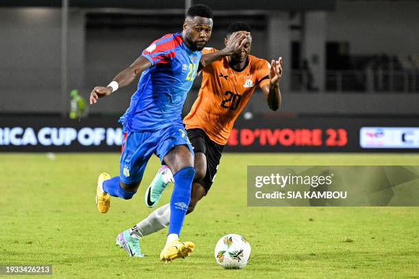 Congo's defender Chancel Mbemba fights for the ball with Zambia's forward Patson Daka during the Africa Cup of Nations 2024 group F football match...
