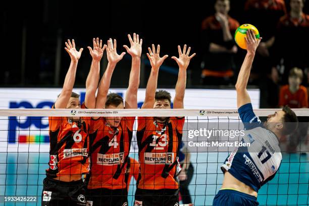 Johannes Tille, Timo Tammemaa and Ruben Schott of the BR Volleys try to block the ball of Yuri Romano of Gas Sales Daiko Piacenza during the...