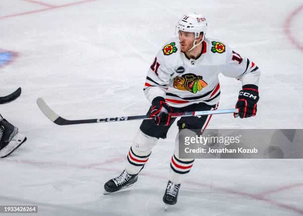 Taylor Raddysh of the Chicago Blackhawks skates during third period action against the Winnipeg Jets at Canada Life Centre on January 11, 2024 in...