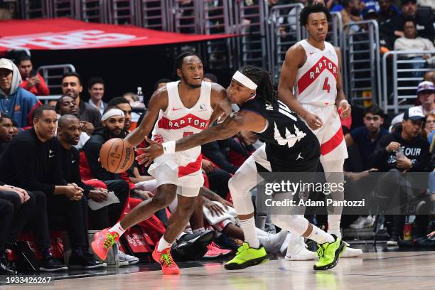 Immanuel Quickley of the Toronto Raptors dribbles the ball during the game against the LA Clippers on January 10, 2024 at Crypto.Com Arena in Los...