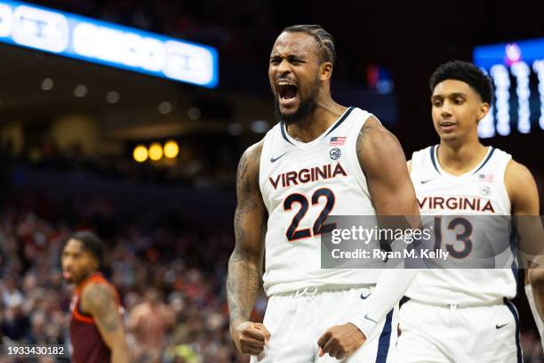 Jordan Minor and Ryan Dunn of the Virginia Cavaliers celebrate in the second half during a game against the Virginia Tech Hokies at John Paul Jones...