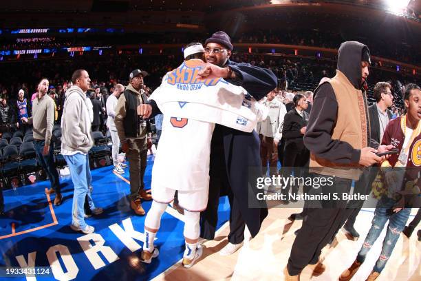 Carmelo Anthony hugs Josh Hart of the New York Knicks after the game against the Houston Rockets on January 17, 2024 at Madison Square Garden in New...