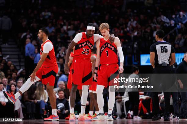 Chris Boucher of the Toronto Raptors talks with teammate Gradey Dick during the second half against the Miami Heat at Scotiabank Arena on January 17,...