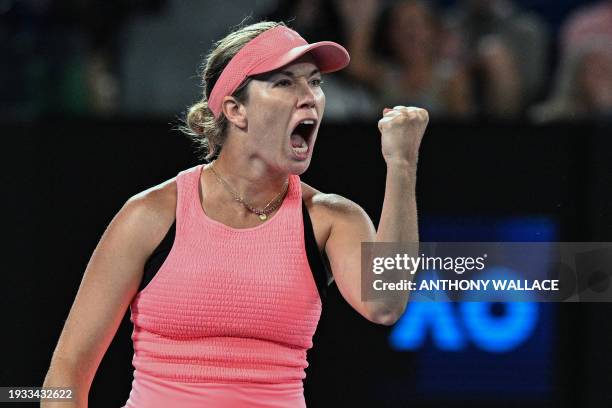 S Danielle Collins reacts after a point against Poland's Iga Swiatek during their women's singles match on day five of the Australian Open tennis...