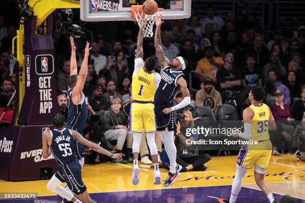 Los Angeles Lakers guard D'Angelo Russell drives on Dallas Mavericks guard Jaden Hardy during the NBA game between the Dallas Mavericks and Los...