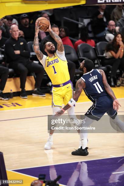 Los Angeles Lakers guard D'Angelo Russell guarded by Dallas Mavericks guard Kyrie Irving during the NBA game between the Dallas Mavericks and Los...