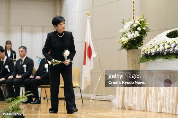 Tokyo Gov. Yuriko Koike offers flowers at an altar set up at the Tokyo metropolitan assembly building on Jan. 18 to commemorate the war dead on Iwoto...