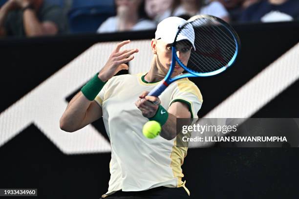 Britain's Jack Draper hits a return against USA's Tommy Paul during their men's singles match on day five of the Australian Open tennis tournament in...