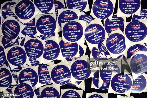 Campaign stickers sit on a table during a rally with former President Donald Trump at Simpson College on January 14, 2024 in Indianola, Iowa. The...