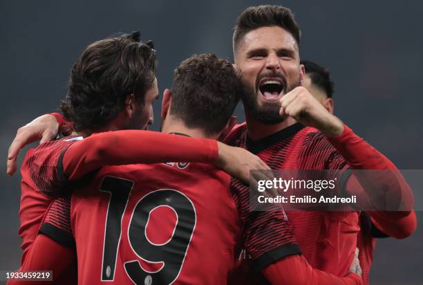 Theo Hernandez of AC Milan celebrates with Olivier Giroud and Yacine Adli after scoring the team's third goal during the Serie A TIM match between AC...