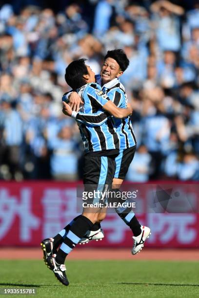 Tatsuya Hasegawa of Kawasaki Frontale celebrates with teammate Kengo Nakamura after scoring the team's first goal during the J.League J1 second stage...