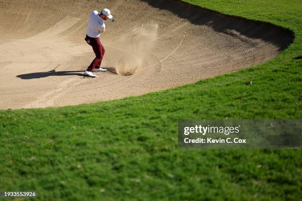 Grayson Murray of the United States plays a shot from a bunker on the 17th hole during the final round of the Sony Open in Hawaii at Waialae Country...