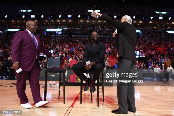 Miami Heat president Pat Riley and former player Dwayne Wade address the crowd during a Hall of Fame ceremony at halftime between the Heat of the...