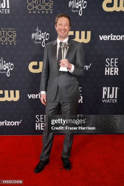 Ebon Moss-Bachrach, winner of the Best Supporting Actor in a Comedy Series award for “The Bear,” poses in the press roomduring the 29th Annual...