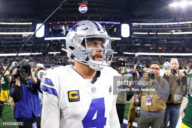 Dak Prescott of the Dallas Cowboys leaves the field following the NFC Wild Card Playoff game against the Green Bay Packers at AT&T Stadium on January...