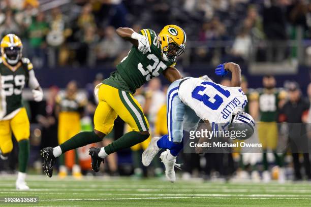 Michael Gallup of the Dallas Cowboys is tackled by Corey Ballentine of the Green Bay Packers during an NFL wild-card playoff football game between...