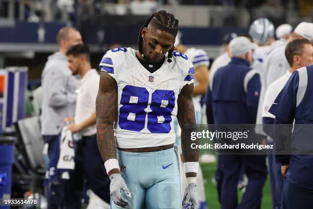 CeeDee Lamb of the Dallas Cowboys walks on the sideline during the NFC Wild Card Playoff game against the Green Bay Packers at AT&T Stadium on...