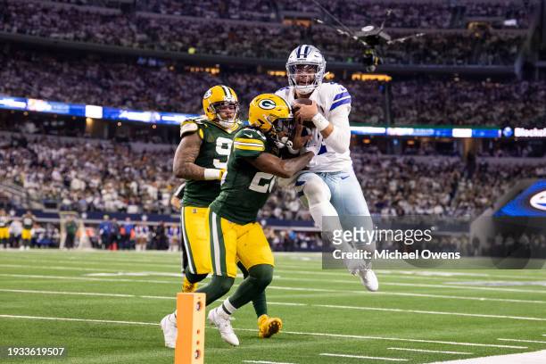 Dak Prescott of the Dallas Cowboys leaps against Darnell Savage of the Green Bay Packers during an NFL wild-card playoff football game between the...