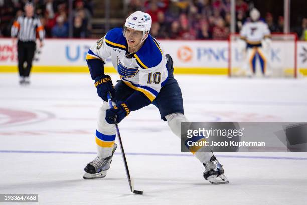 Brayden Schenn of the St. Louis Blues brings the puck up the ice against the Carolina Hurricanes during their game at PNC Arena on January 06, 2024...