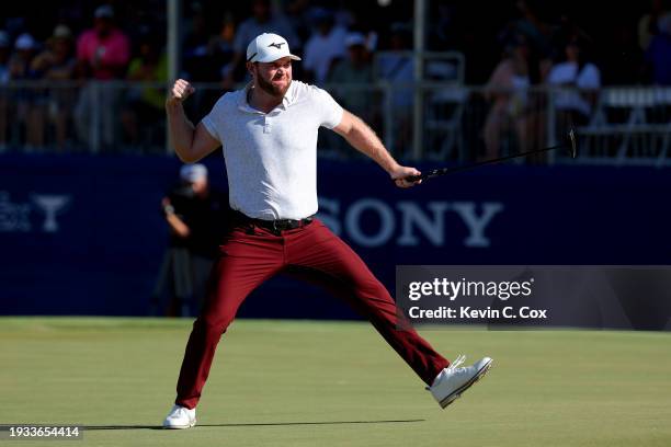 Grayson Murray of the United States celebrates after making a putt on the 18th green during the playoff round against Keegan Bradley of the United...