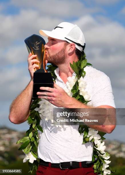 Grayson Murray of the United States poses with the championship trophy after victory on the first play-off hole during the final round of the Sony...