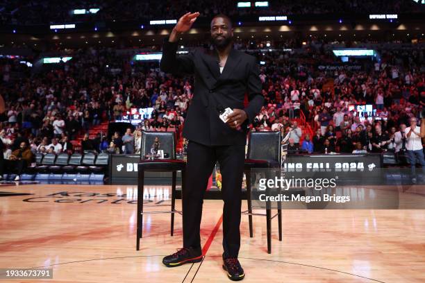Former Miami Heat player Dwayne Wade addresses the crowd during a Hall of Fame induction ceremony at halftime against the Charlotte Hornets at Kaseya...