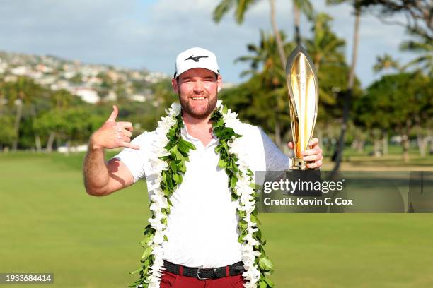 Grayson Murray of the United States poses with the championship trophy after victory on the first play-off hole during the final round of the Sony...