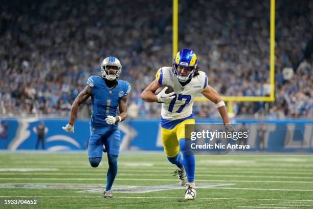 Puka Nacua of the Los Angeles Rams catches a pass for a touchdown during the second quarter against the Detroit Lions in the NFC Wild Card Playoffs...