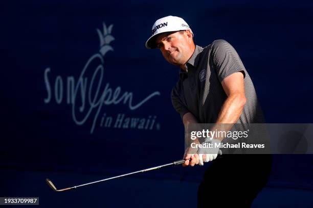 Keegan Bradley of the United States takes a shot on the 18th green during the first playoff hole against Grayson Murray of the United States and...