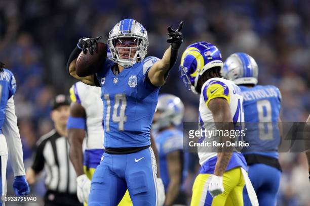 Amon-Ra St. Brown of the Detroit Lions reacts after making a first down during the third quarter against the Los Angeles Rams in the NFC Wild Card...