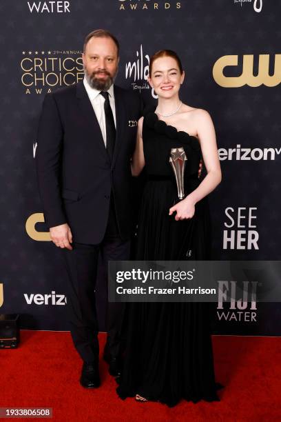 Yorgos Lanthimos and Emma Stone, winner of the Best Actress Award for "Poor Things," during the 29th Annual Critics Choice Awards at Barker Hangar on...