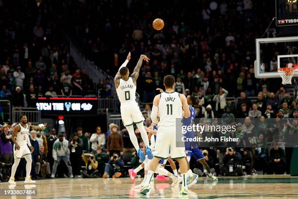 Damian Lillard of the Milwaukee Bucks hits the gaming winning shot with no time left on clock in overtime against the Sacramento Kings at Fiserv...