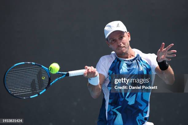 James Duckworth of Australia plays a forehand in their round one singles match against Luca Van Assche of France during the 2024 Australian Open at...