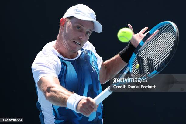 James Duckworth of Australia plays a backhand in their round one singles match against Luca Van Assche of France during the 2024 Australian Open at...