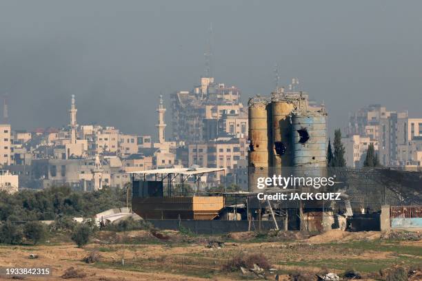 Picture taken from southern Israel shows destroyed buildings in the Gaza Strip on January 18 amid the ongoing battles between Israel and the...