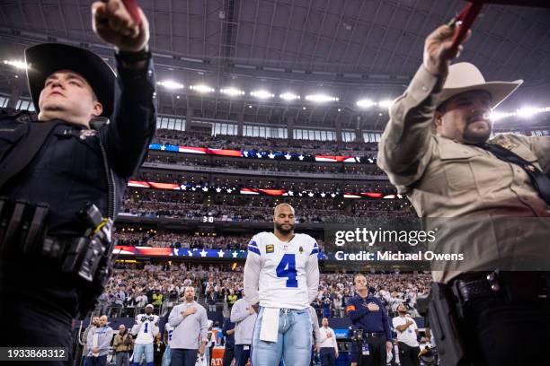 Dak Prescott of the Dallas Cowboys takes a moment during the national anthem prior to an NFL wild-card playoff football game between the Dallas...