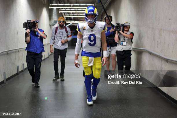 Matthew Stafford of the Los Angeles Rams walks to the locker room after being defeated by the Detroit Lions 24-23 in the NFC Wild Card Playoffs at...