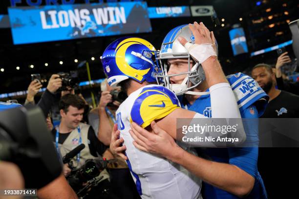 Matthew Stafford of the Los Angeles Rams hugs Jared Goff of the Detroit Lions following the game in the NFC Wild Card Playoffs at Ford Field on...