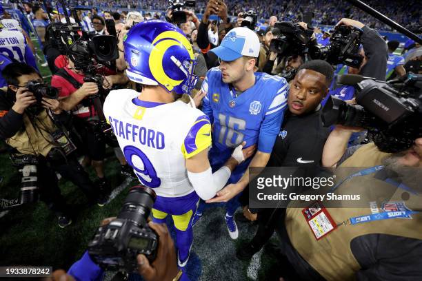 Matthew Stafford of the Los Angeles Rams talks with Jared Goff of the Detroit Lions following the NFC Wild Card Playoffs at Ford Field on January 14,...