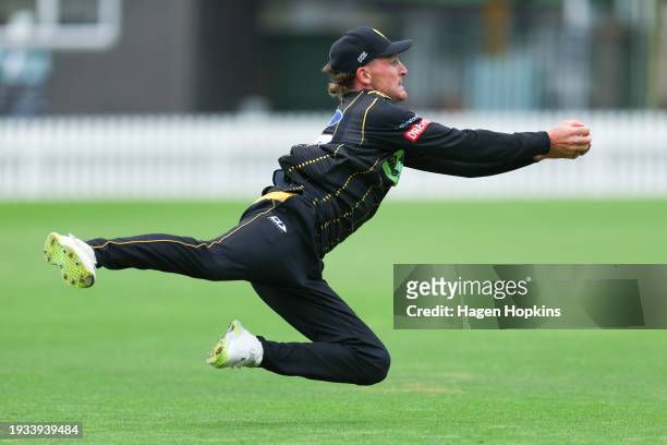 Nathan Smith of Wellington takes a catch to dismiss Katene Clark of Northern Districts during the T20 Super Smash match between the Wellington...